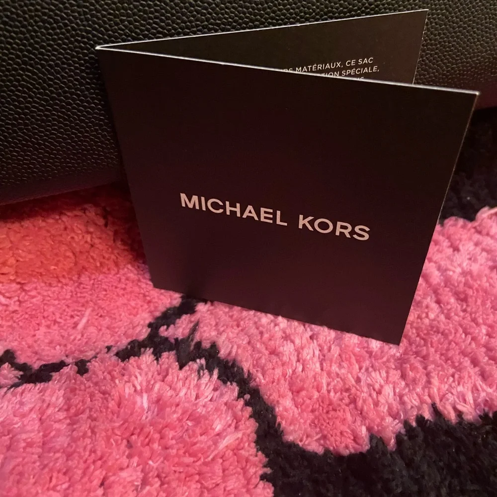 Authentic Michael, Kors, laptop case black on black in color brand new with tag